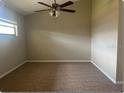 Neutral bedroom featuring new carpet, fan/light fixture, and bright natural light at 1606 Red Clover Ct, Orlando, FL 32825