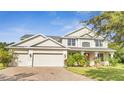 Charming two-story home featuring a three-car garage and well-maintained landscaping at 4394 Devon Ct, Kissimmee, FL 34746