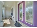 Welcoming front porch with a decorative glass door and classic white columns at 4394 Devon Ct, Kissimmee, FL 34746