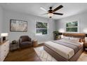 Comfortable bedroom with ample natural light and hardwood floors at 520 Sumner Ave, Orange City, FL 32763