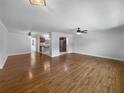 Spacious living room featuring hardwood floors and natural light at 520 Sumner Ave, Orange City, FL 32763