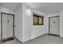 Hallway with a window and two doors, each with a welcome mat at 5207 S Atlantic Ave # 225, New Smyrna Beach, FL 32169