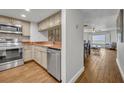 A kitchen with stainless steel appliances and a view of the ocean from the connected living space at 5207 S Atlantic Ave # 225, New Smyrna Beach, FL 32169