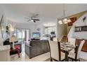 Bright and airy living area with dining space, flowing into a modern kitchen, perfect for entertaining and everyday living at 528 Terra Lago St, Davenport, FL 33897