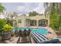 Relaxing pool area with patio furniture, perfect for outdoor entertaining at 1012 W New Hampshire St, Orlando, FL 32804