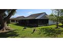 Spacious backyard with a screened-in lanai perfect for outdoor gatherings at 11818 Sophia Ln, Orlando, FL 32821