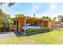Cozy exterior view features a carport with a parked car and well-maintained landscaping at 2272 Raeford Rd # A-3, Orlando, FL 32806