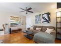 Inviting living room with hardwood floors, ceiling fan and comfortable seating at 2272 Raeford Rd # A-3, Orlando, FL 32806