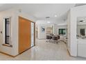 Spacious foyer with marble floors, a decorative front door, and an open floor plan at 2652 Bent Hickory Cir, Longwood, FL 32779