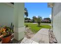 View of the yard, street and neighborhood from the front porch at 2710 Autumn Ln, Eustis, FL 32726