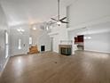 Bright living room featuring vaulted ceilings, fireplace, and an open floor plan at 306 Foxboro Ct, Lake Mary, FL 32746