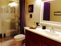 Bathroom featuring tiled flooring, wood vanity, and glass enclosed shower with attractive shower tile at 3312 Bridgeford Dr, Orlando, FL 32812