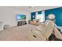 Spacious living room with reclining leather seating and modern decor at 356 Quarry Rock Cir, Kissimmee, FL 34758