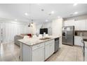 Open-concept kitchen with large island, granite countertops, and stainless steel appliances at 4314 Lana Ave, Davenport, FL 33897