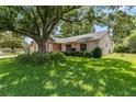 Well-maintained home with a green lawn and shade trees at 4930 Gifford Blvd, Orlando, FL 32821
