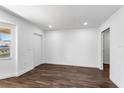 Bright living room with modern wood flooring, neutral walls, and natural light at 611 Lakespur Ln, Altamonte Springs, FL 32714