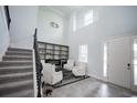 Grand foyer with soaring ceilings, natural light, and a staircase, creating an inviting first impression for guests at 7536 Green Mountain Way, Winter Garden, FL 34787