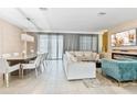 Open-concept living and dining area is filled with natural light and designer furnishings at 8833 Cruden Bay Ct, Davenport, FL 33896