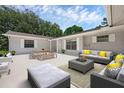 Outdoor patio area featuring comfortable seating, a dining table, and a stylish design, perfect for entertaining at 103 Longhorn Rd, Winter Park, FL 32792