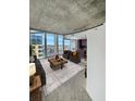 Bright living room features an open floor plan with a cozy seating area and large windows with great views at 155 S Court Ave # 2008, Orlando, FL 32801
