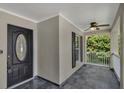 Cozy front porch featuring a ceiling fan and tiled flooring, offering a comfortable outdoor space at 2028 Donegan Pl, Orlando, FL 32826