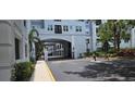 Gated entry featuring mature palm trees and black iron fencing at 204 E South St # 4056, Orlando, FL 32801