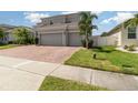 Charming home featuring a two-car garage and well-maintained lawn at 2061 Rush Bay Way, Orlando, FL 32824