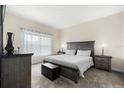 Spacious bedroom features a large bed with plush bedding, soft carpet, and plenty of natural light from the window at 3007 Caneel St, Winter Haven, FL 33884