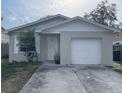 Cozy single-story home with a well-maintained lawn and attached one car garage and neutral paint at 3347 Timberline W Rd, Winter Haven, FL 33880