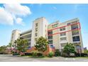 Attractive condominium with multiple levels, balconies, and well-maintained landscaping at 5300 S Atlantic Ave # 6-507, New Smyrna Beach, FL 32169