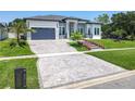 Attractive front yard with manicured lawn, patterned driveway, and decorative landscaping at 601 Green Briar Blvd, Altamonte Springs, FL 32714