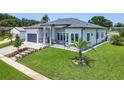 Charming home featuring a well-kept lawn, decorative landscaping, and a view of the side yard at 601 Green Briar Blvd, Altamonte Springs, FL 32714