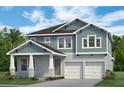 Charming two-story home featuring a 2-car garage, covered entry and traditional architectural details at 13081 Sunrise Harvest Dr, Winter Garden, FL 34787