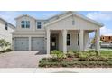 Inviting two-story home with a two-car garage and lush landscaping at 13175 Telsen St # 40, Winter Garden, FL 34787