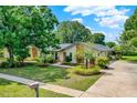 A well maintained single story home featuring a spacious yard and inviting curb appeal at 1390 Yellow Pine Ct, Winter Springs, FL 32708