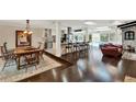 Open concept living space with hardwood floors, a large island and views of the pool at 1390 Yellow Pine Ct, Winter Springs, FL 32708