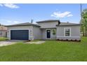 Charming single-Gathering home showcasing a well-manicured lawn and a brick driveway at 15443 Sw 21St Ct, Ocala, FL 34473