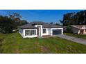 Inviting single-Gathering home with a well-maintained lawn and a stylish exterior, showcasing a warm and welcoming curb appeal at 16367 Sw 17Th Terrace Rd, Ocala, FL 34473
