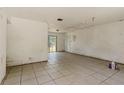 Spacious living room with tile floors and sliding glass doors leading to the backyard at 315 Panama Cir, Winter Springs, FL 32708