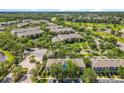 Community aerial view showcasing lush greenery, multiple buildings, and convenient parking at 3309 Wilshire Way Rd # 3, Orlando, FL 32829