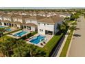 Backyard aerial view showcasing a sparkling pool, spa, and outdoor seating area at 341 Burma St, Kissimmee, FL 34747