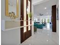 Bright entryway featuring sleek white marble floors, modern decor, and an open floor plan at 3860 Sonoma Blvd, Kissimmee, FL 34741