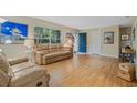 Comfortable living room with a large window and hardwood floors at 750 W May St, Deland, FL 32720