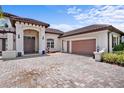 Charming home featuring a two car garage and well-manicured landscaping at 10352 Burris Ct, Orlando, FL 32836