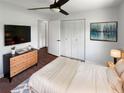 Cozy bedroom featuring a comfortable bed, spacious closets, and modern decor for a relaxing retreat at 14837 Sussex Dr, Orlando, FL 32826