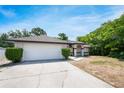 Traditional single-story home boasting a two-car garage and well-kept shrubbery at 1617 Hallcrest Dr, Deltona, FL 32725