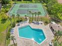 Aerial view of community pool and tennis courts offering a relaxing and active lifestyle at 168 Perimeter Ct # 5C, Deltona, FL 32725