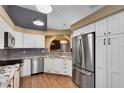 Modern kitchen with granite countertops and stainless steel appliances at 2945 Lake Pineloch Blvd # 18-26, Orlando, FL 32806