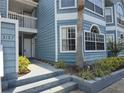 Attractive condo exterior with blue siding, well-maintained landscaping and private entry at 3157 Britannia Blvd # B, Kissimmee, FL 34747
