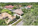 Aerial view of a residence featuring a screened pool, mature trees, and well-maintained surroundings at 356 N Spaulding Cv, Lake Mary, FL 32746